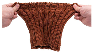 Hands stretching a knit snood to show the elastic band